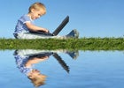 photo of kid with laptop